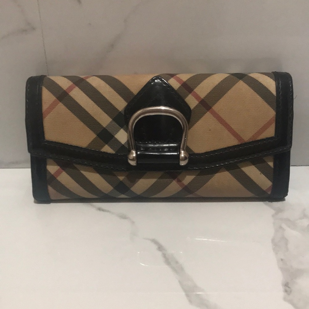Burberry wallet. Some nicks and marks.